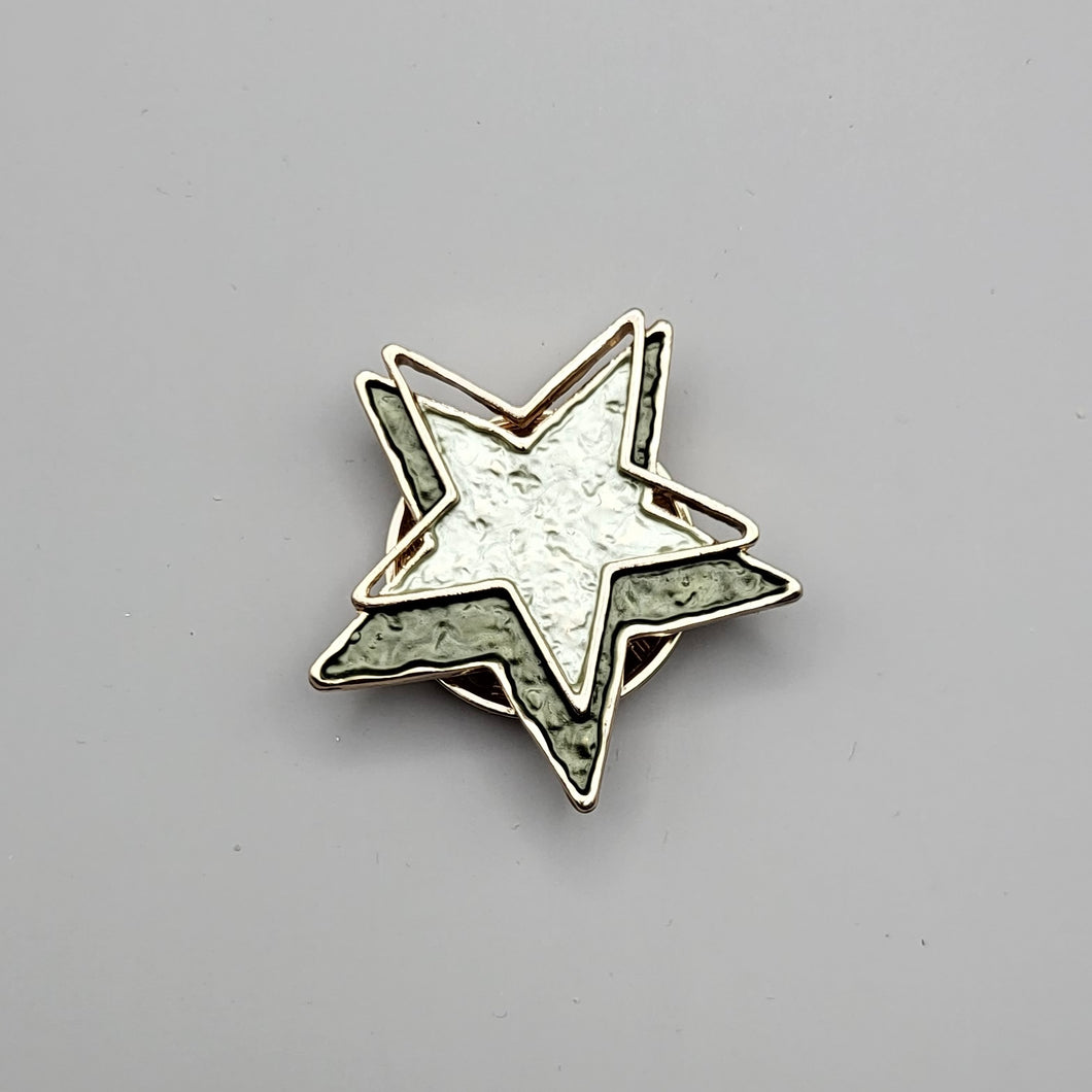 Enamelled Green and Gold Star Brooch