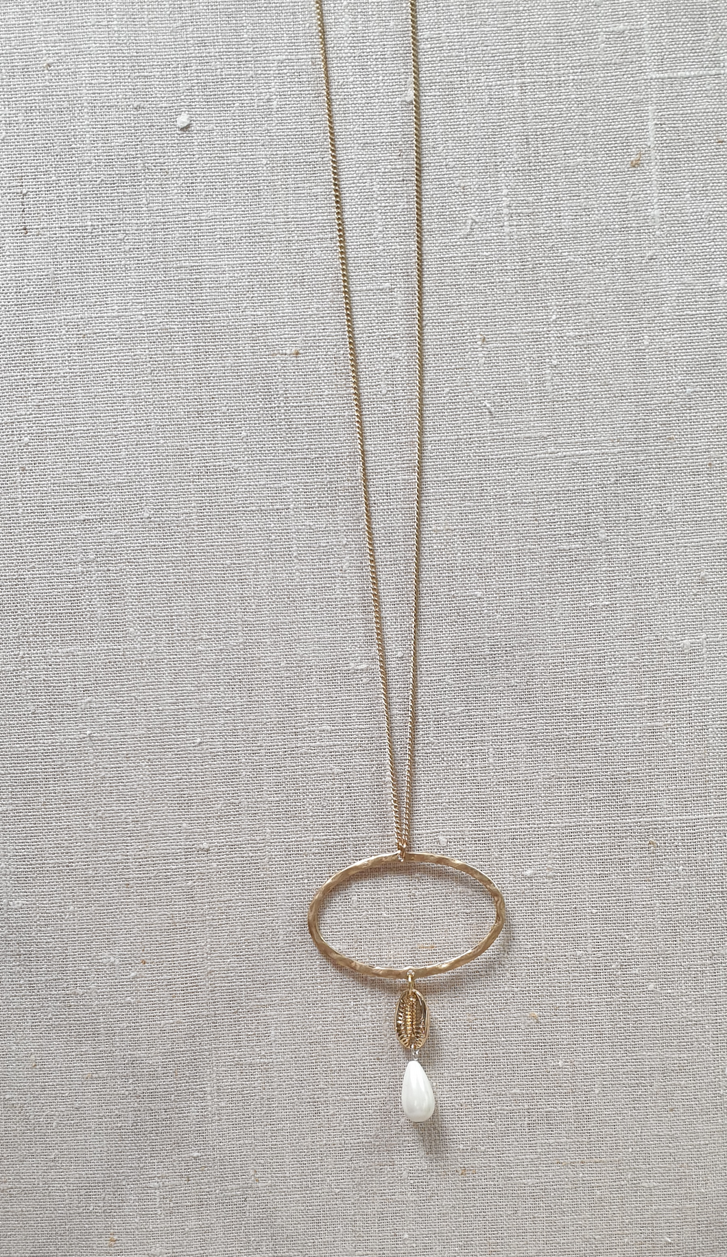 Gold cowrie shell necklace