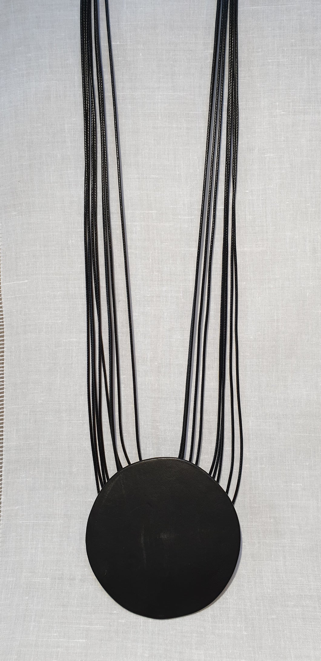 Suede medallion
